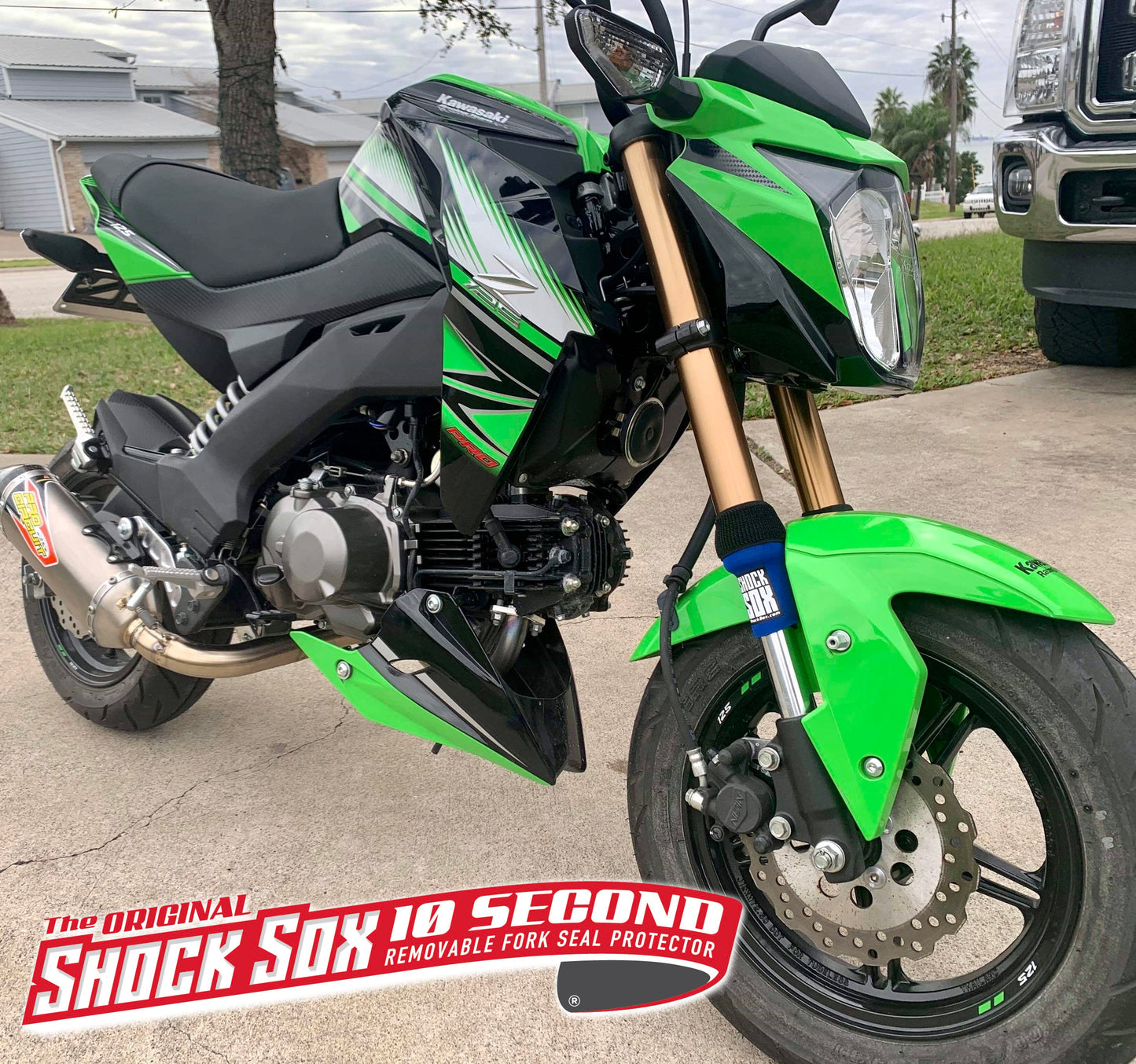 A Kawasaki street bike with blue 4U Shock Sox.