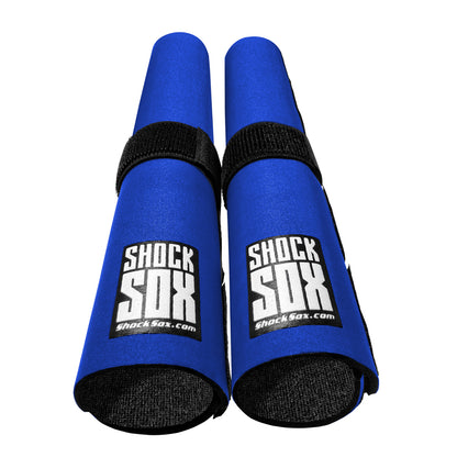 Pair of blue 13in Shock Sox on a white background