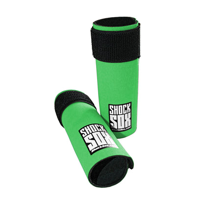 Pair of green 6U Shock Sox on a white background