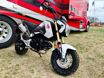 A Honda Grom with red 4U Shock Sox.
