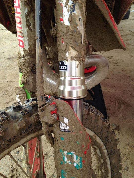 A closeup of what dirt bike forks look like after being protected by Shock Sox.