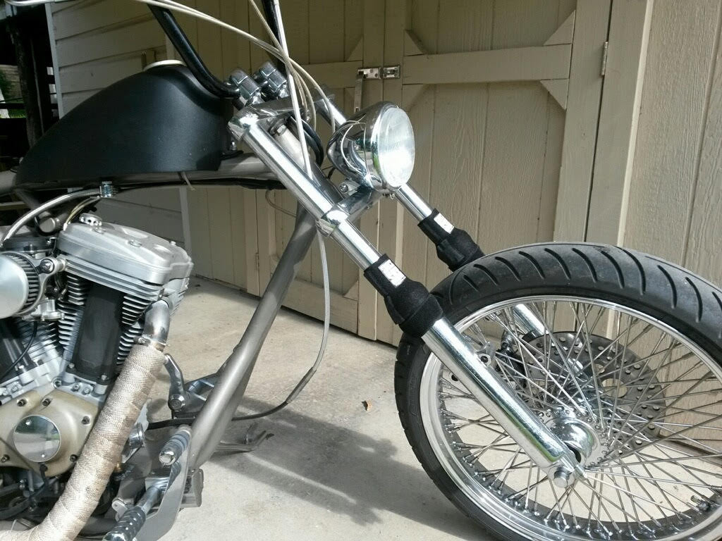 A picture of a street bike with black Shock Sox on it.