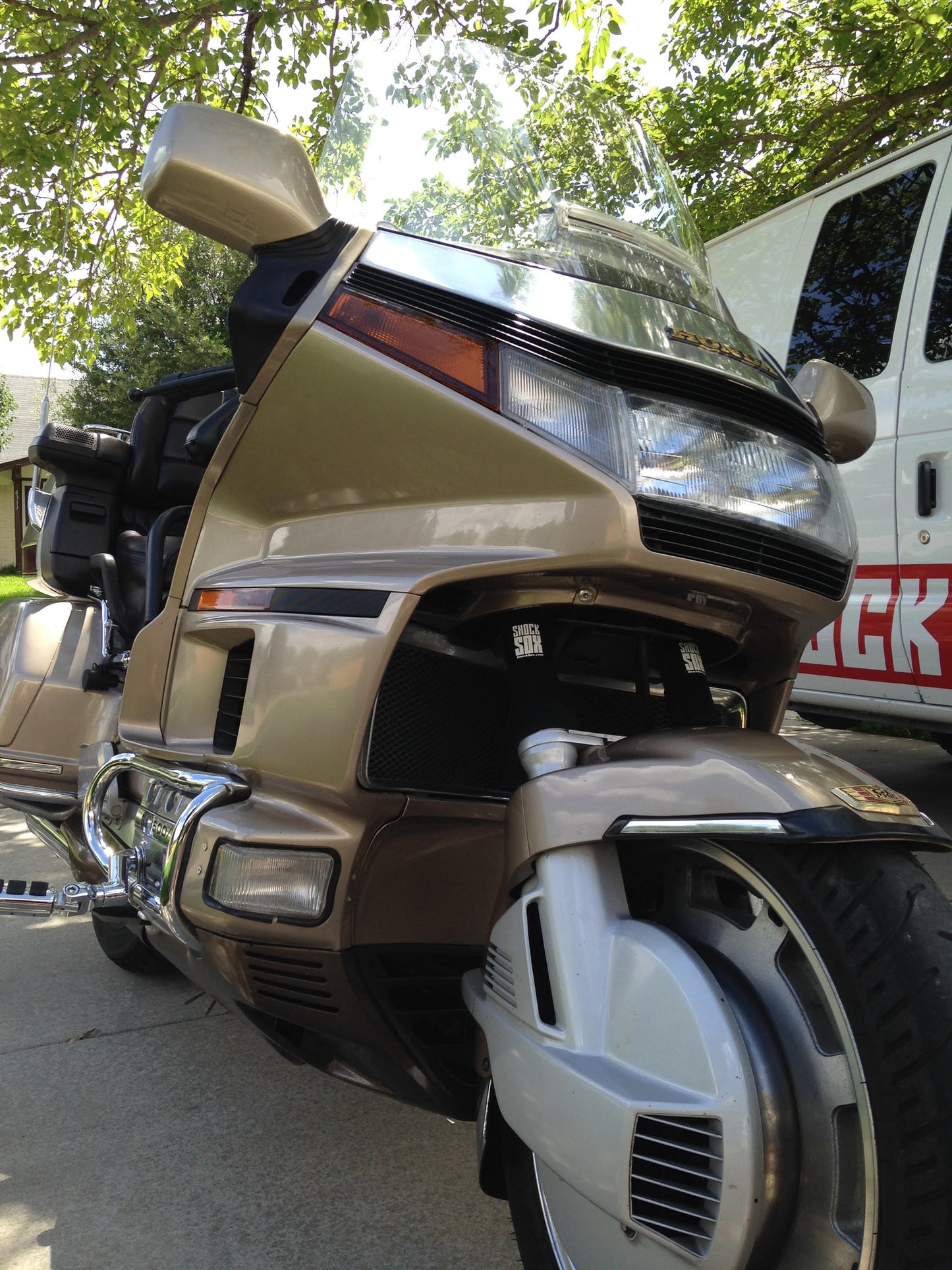 A picture of an old street bike with black Shock Sox on it.