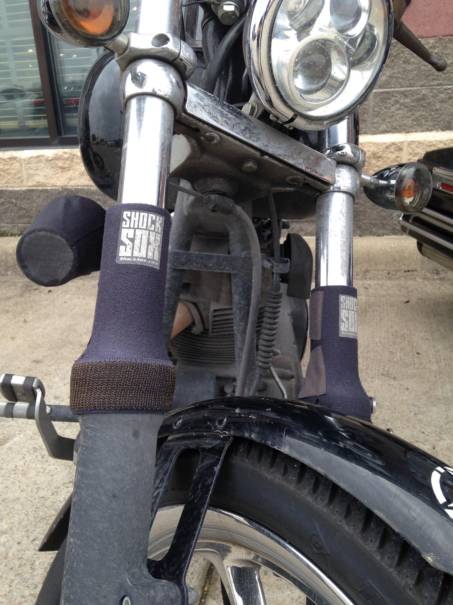A picture of a street bike with black Shock Sox on it.