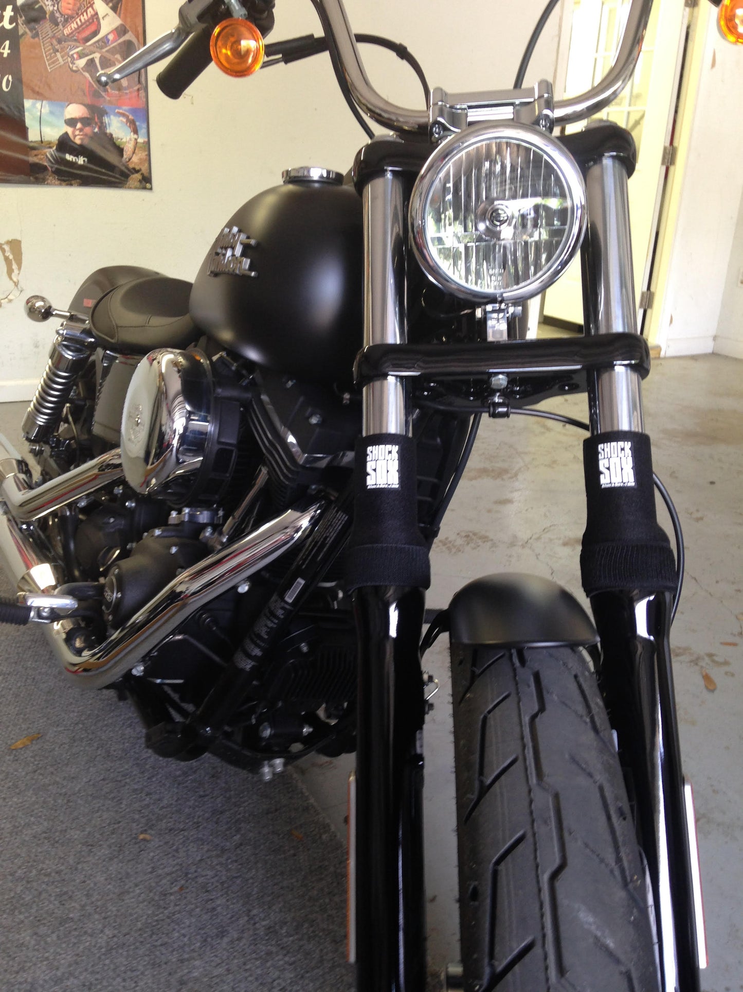 A picture of a street bike with black Shock Sox on it.