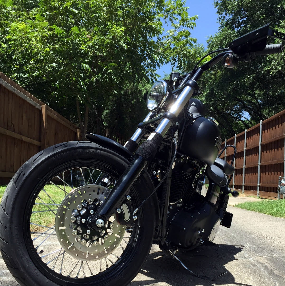 A picture of a street bike with black Shock Sox on it.