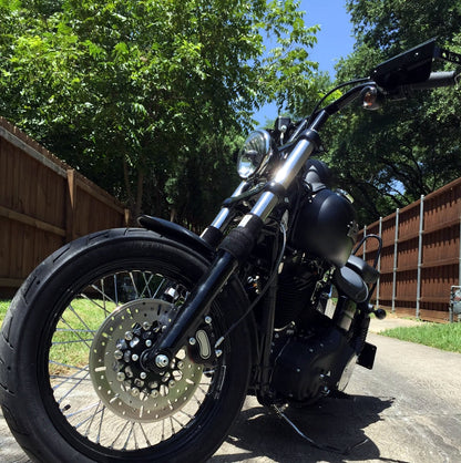 A picture of a street bike with black Shock Sox on it.