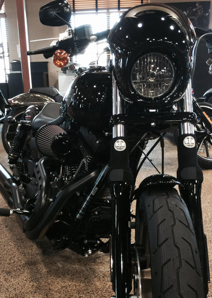 A picture of a street bike with black Shock Sox on it.