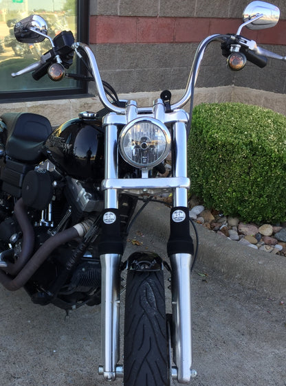 A picture of a street bike with black Shock Sox on it.