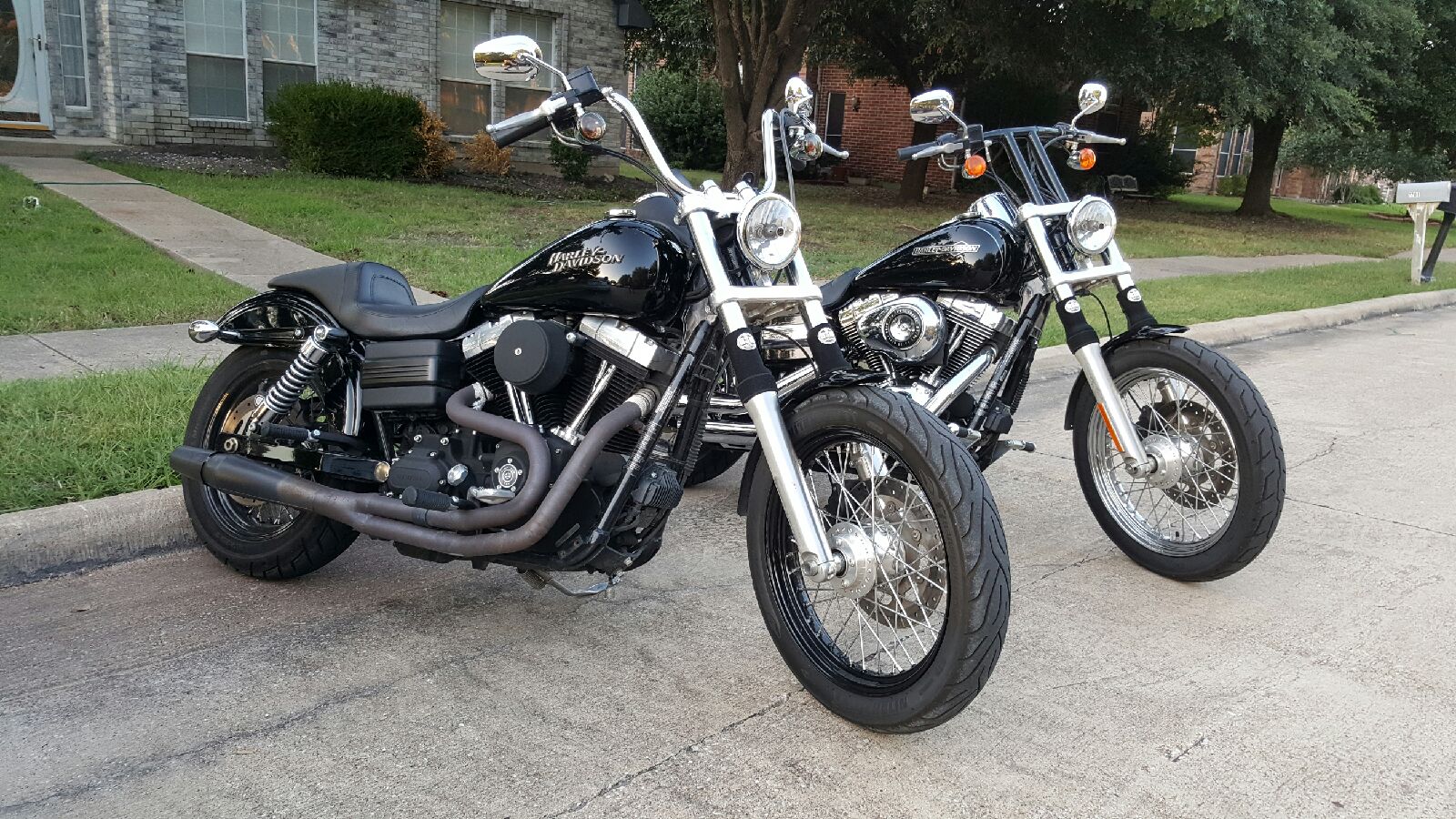 A picture of two street bikes with black 6C Shock Sox on them.