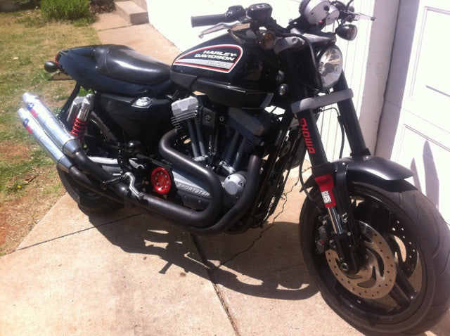 A picture of a street bike with red Shock Sox on it.
