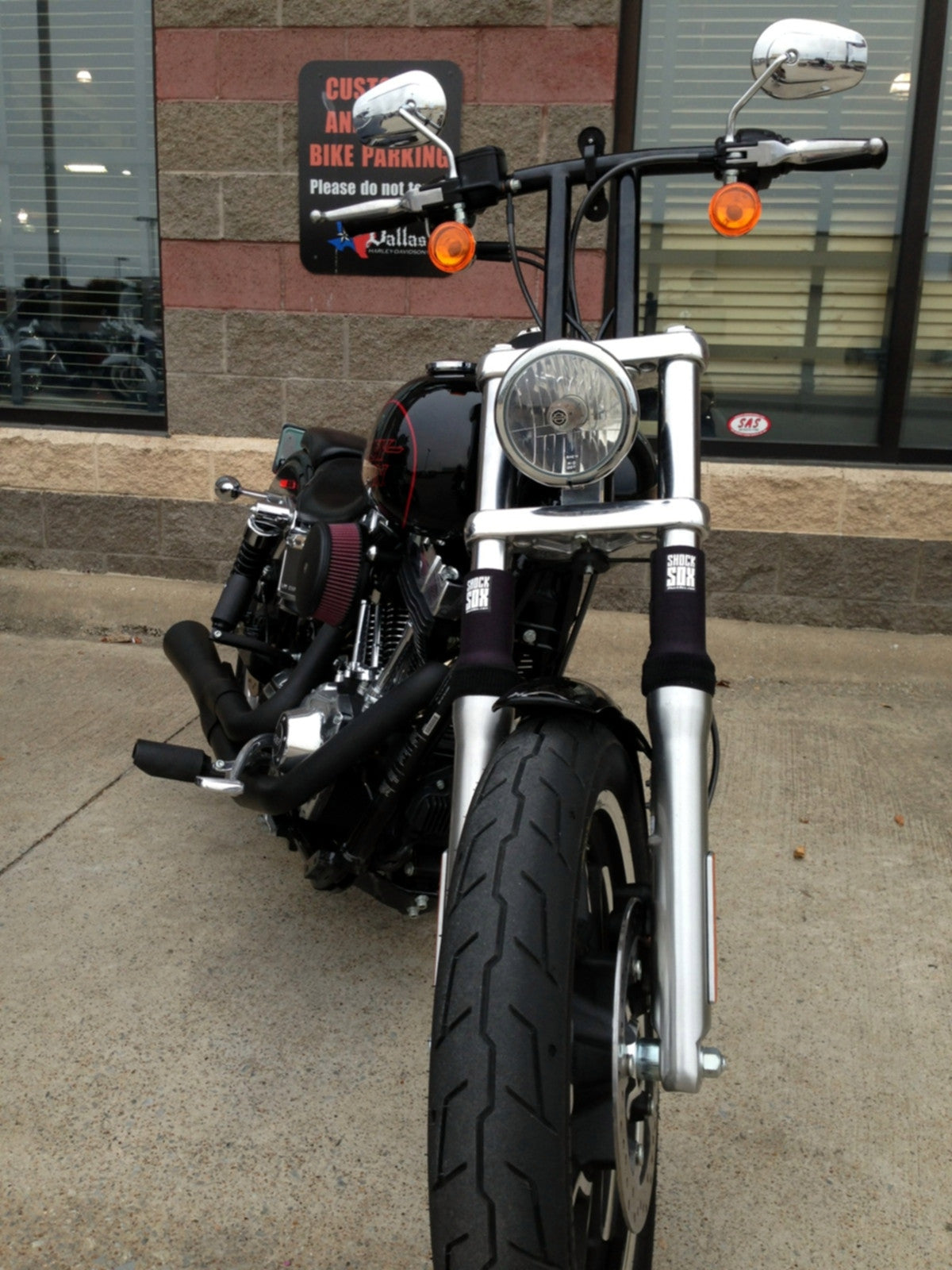 A picture of a street bike with black Shock Sox on it.