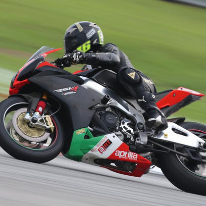 A picture of someone racing a street bike with red Shock Sox on it.