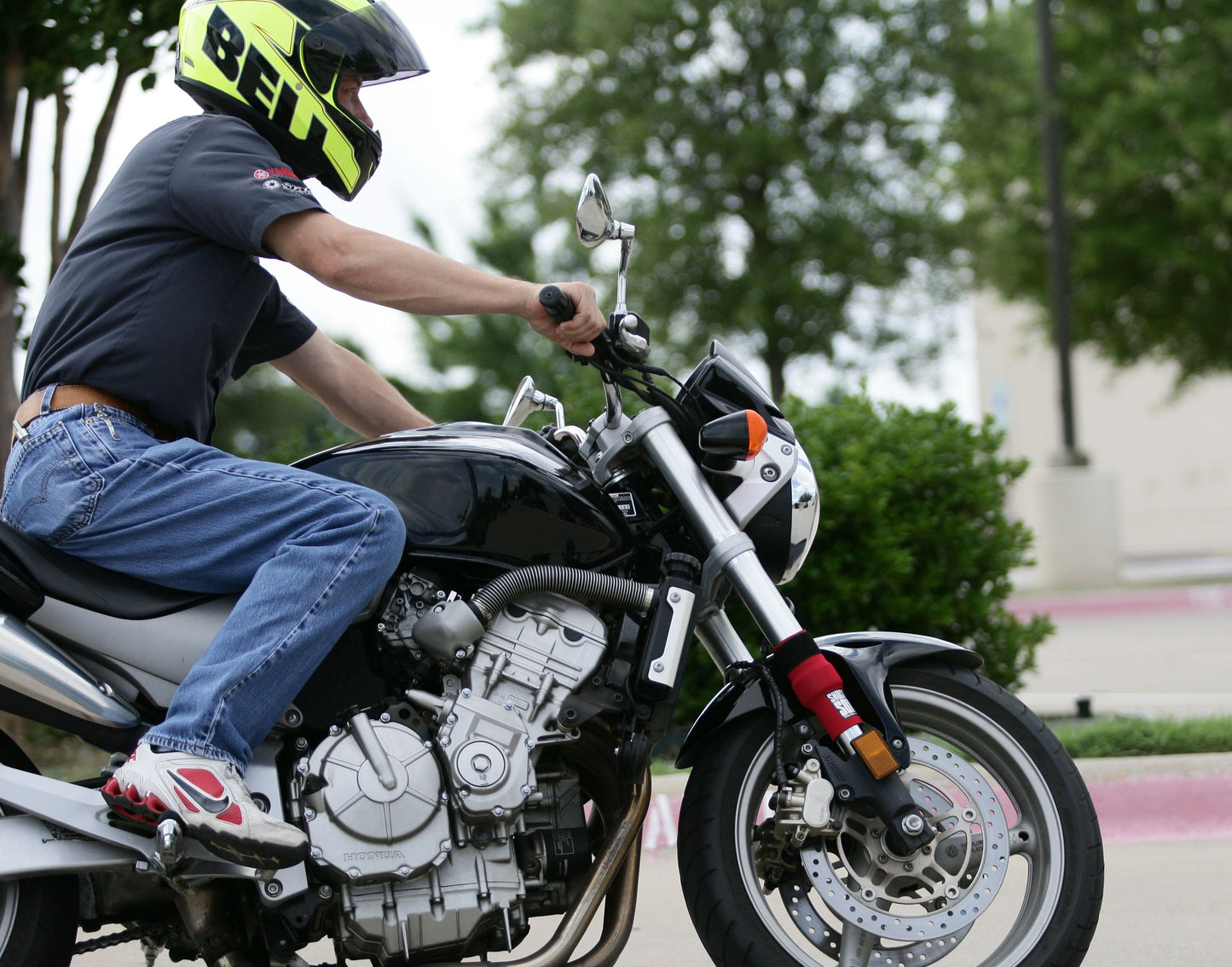 A picture of a street bike with red Shock Sox on it.
