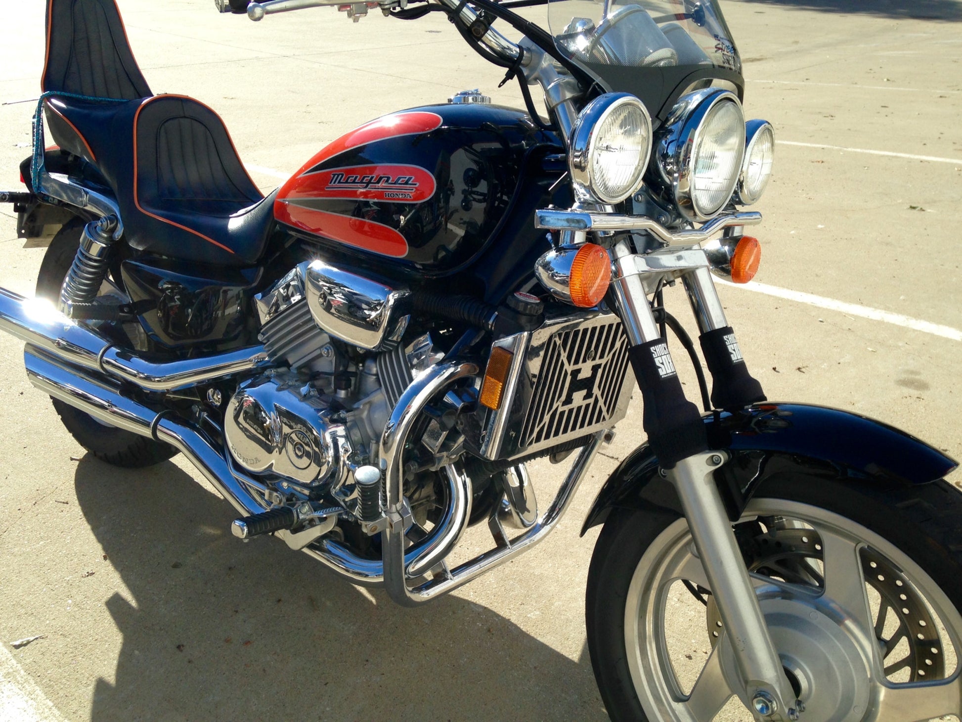 A picture of a street bike with black Shock Sox on it.