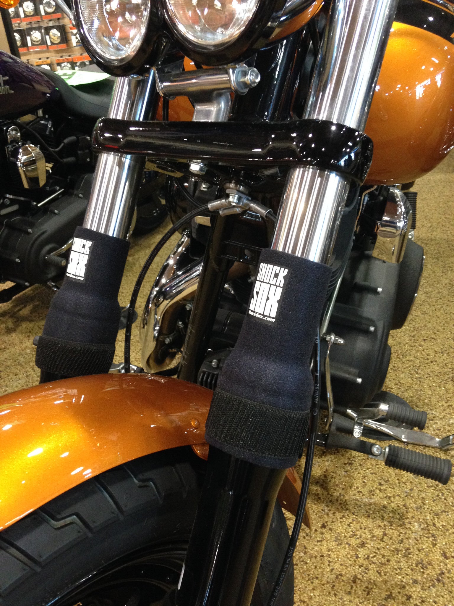 A picture of a street bike with black Shock Sox on it.