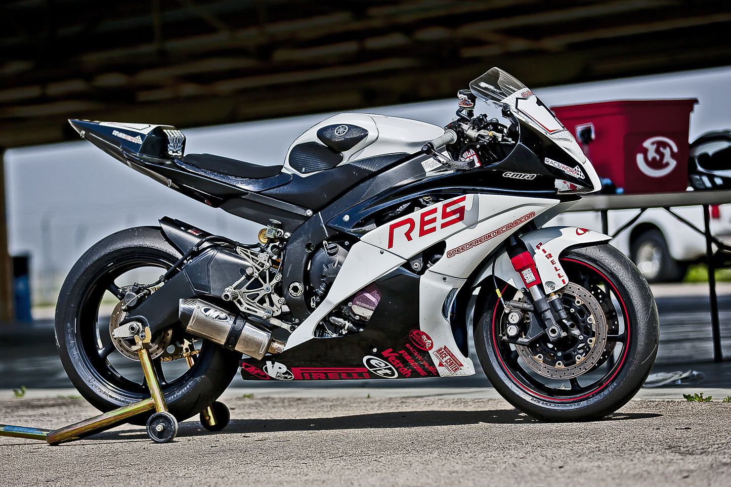 A picture of a street bike with red Shock Sox on it.
