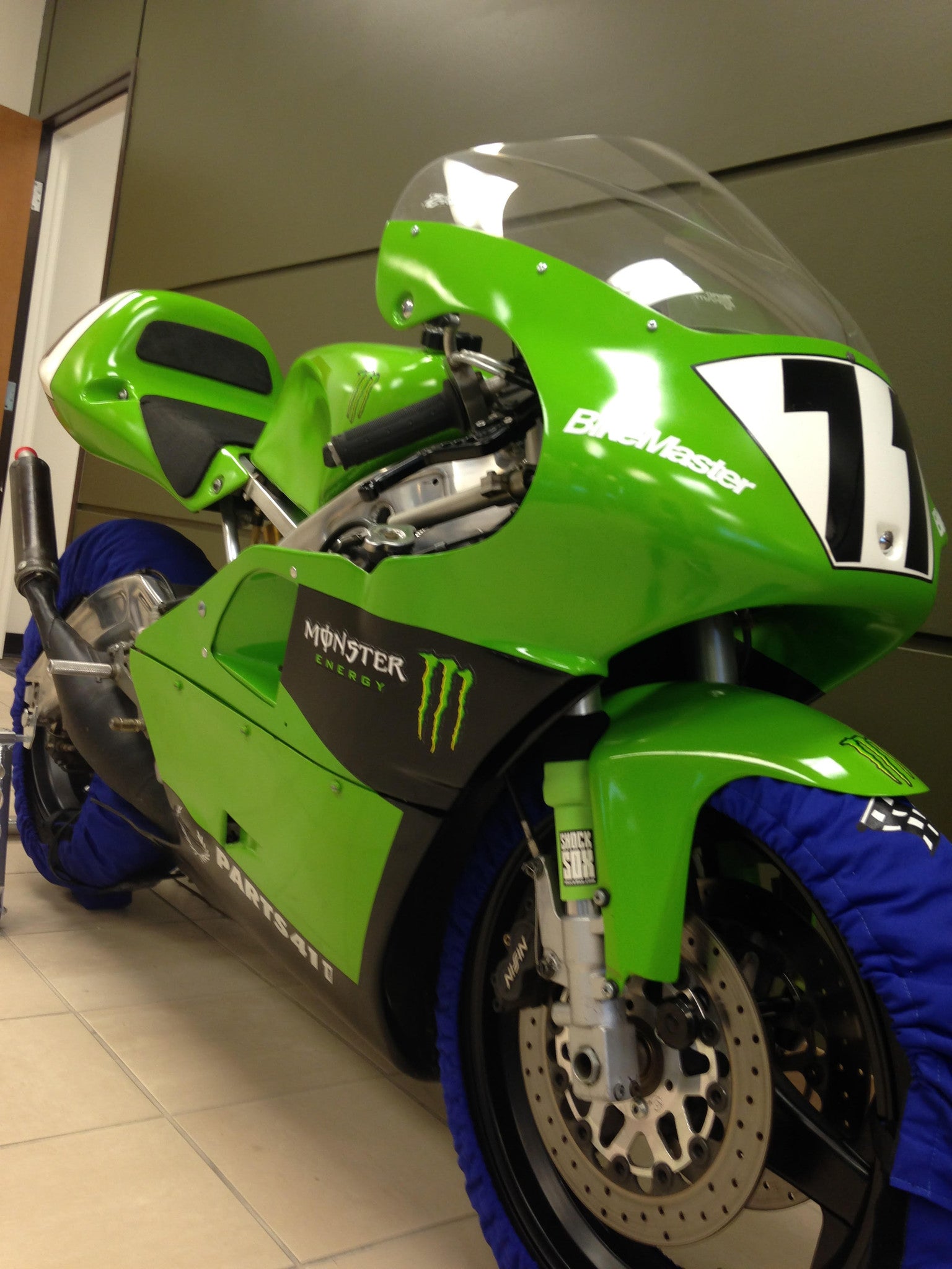 A picture of a green street bike with green Shock Sox on it.
