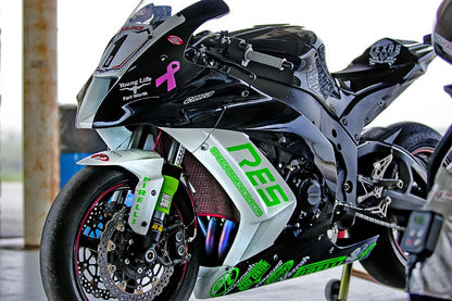 A picture of a street bike with green Shock Sox on it.